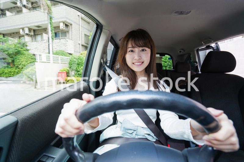 Young woman driving a car