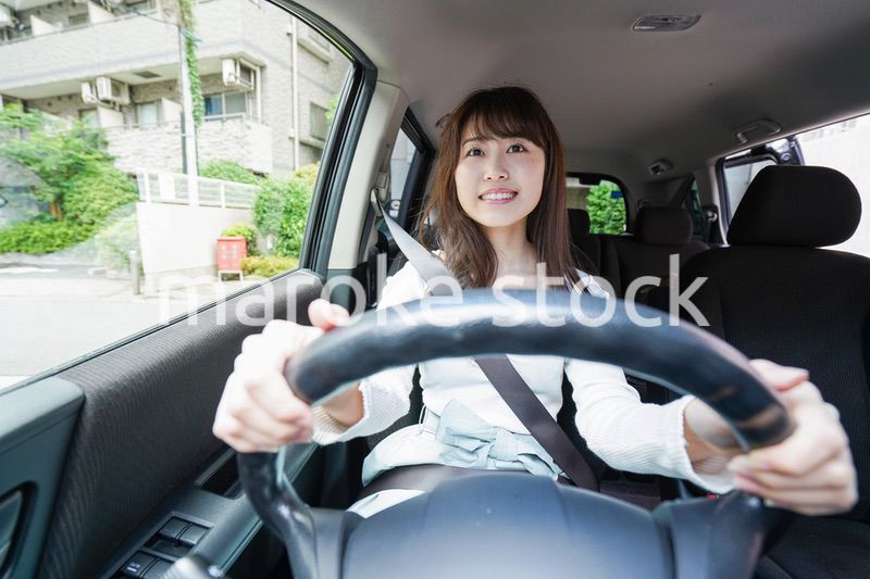 Young woman driving a car