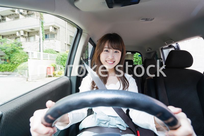 Young woman driving a car