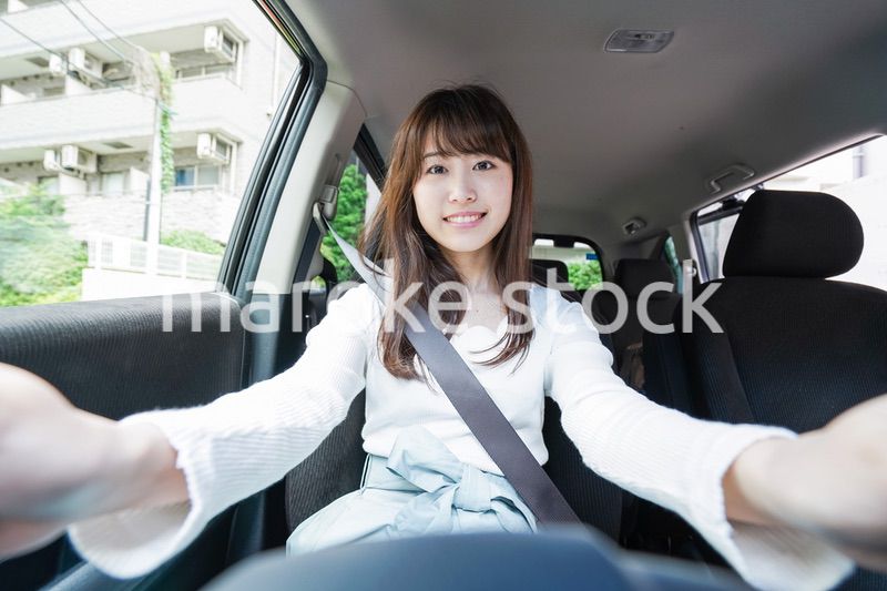 Young woman driving a car