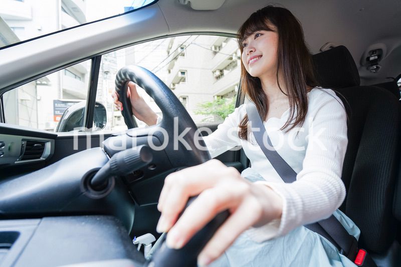 Young woman driving a car