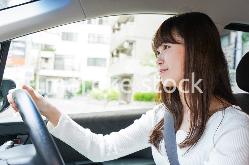 Young woman driving a car