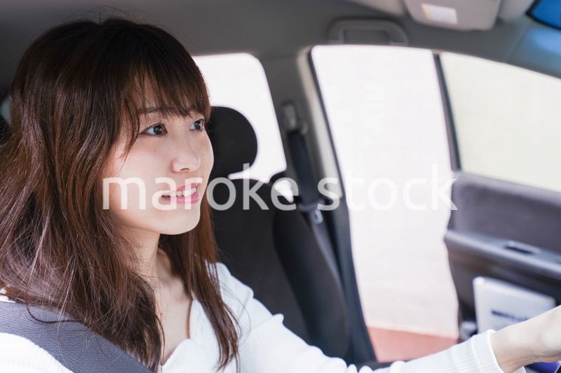Young woman driving a car