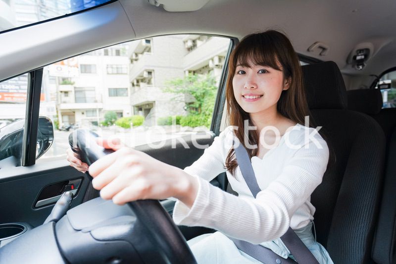 Young woman driving a car