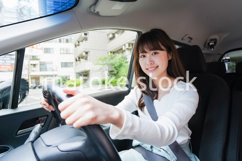 Young woman driving a car