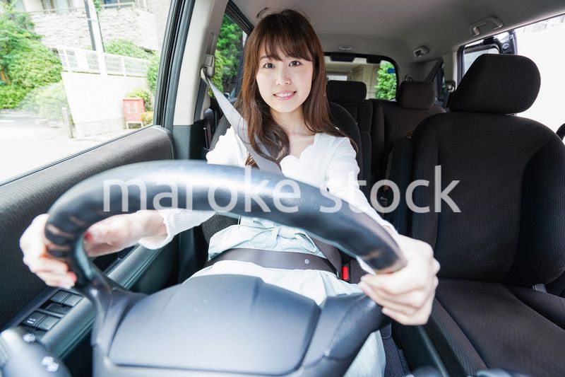 Young woman driving a car