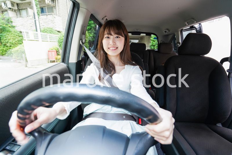 Young woman driving a car