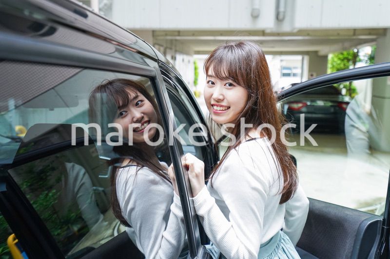 Woman go into a car