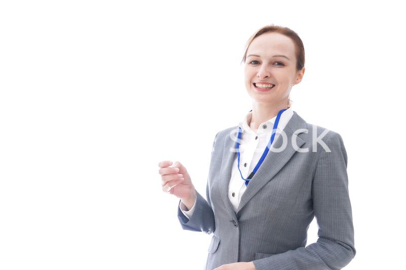 大笑いをするスーツを着たビジネスウーマン