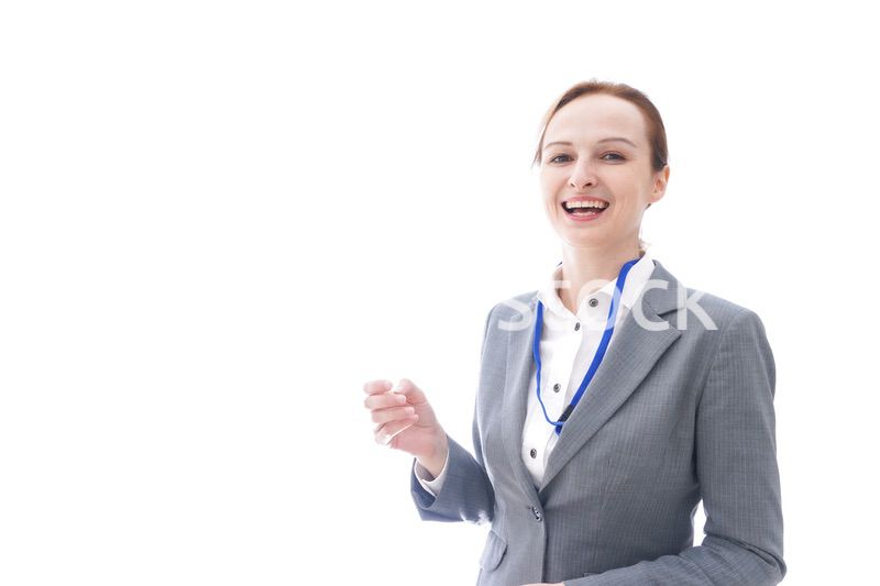 大笑いをするスーツを着たビジネスウーマン