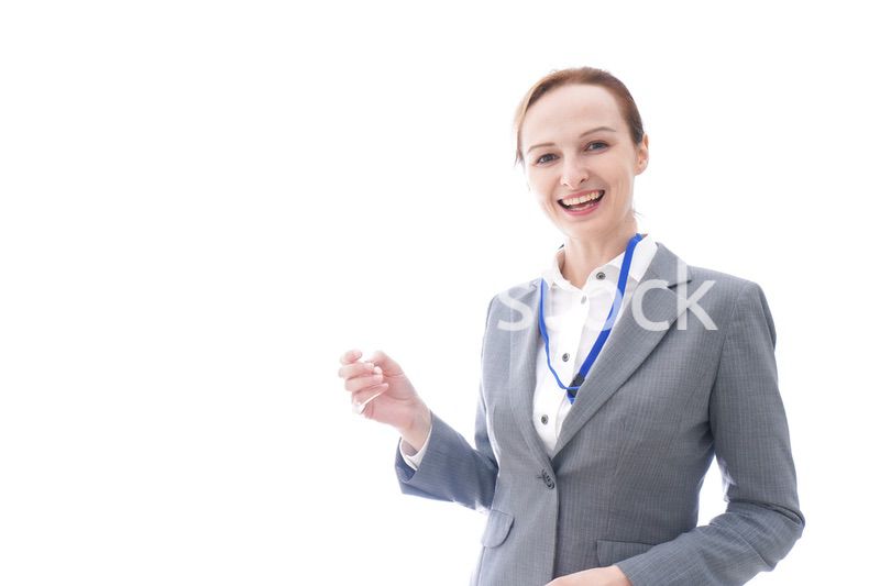 大笑いをするスーツを着たビジネスウーマン