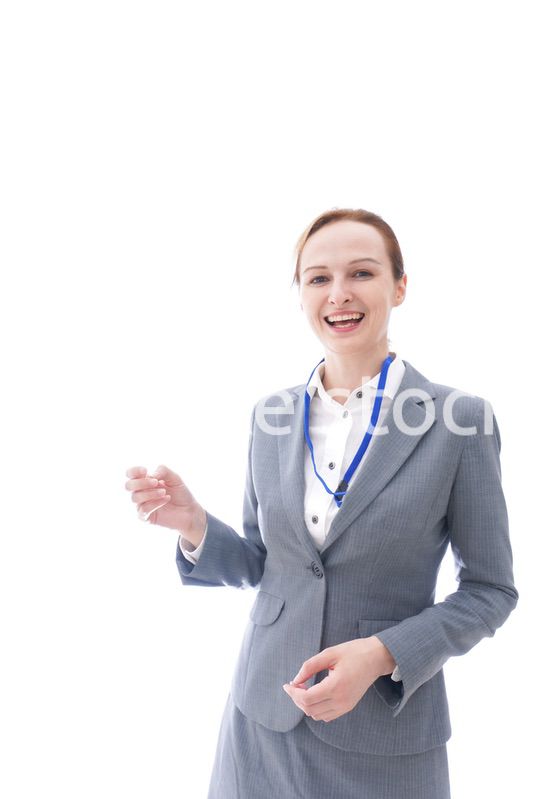 大笑いをするスーツを着たビジネスウーマン