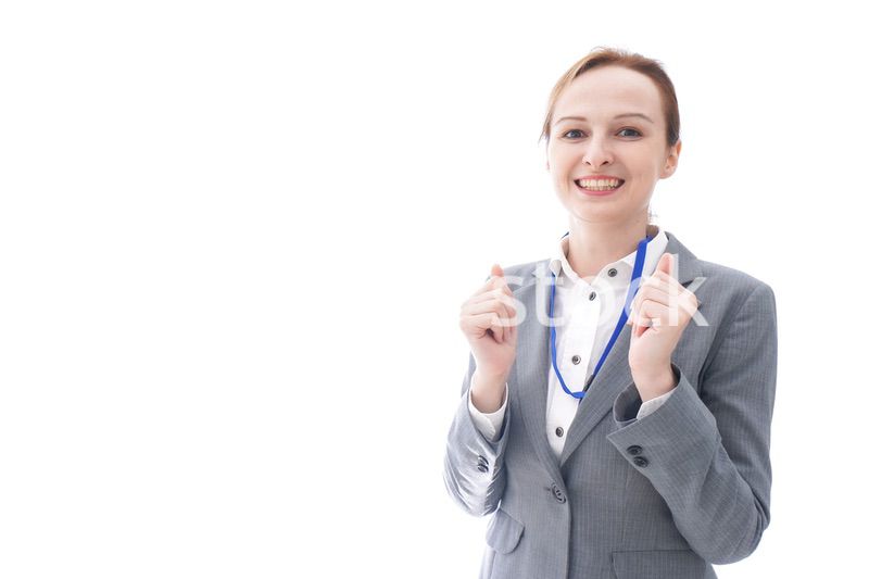 大笑いをするスーツを着たビジネスウーマン