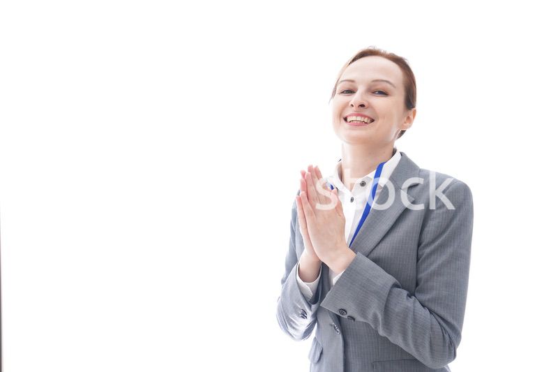 大笑いをするスーツを着たビジネスウーマン