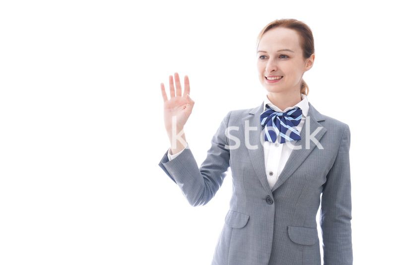 手をふる制服を着た留学生