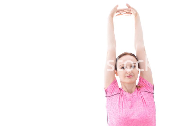 ストレッチをする笑顔の若い女性