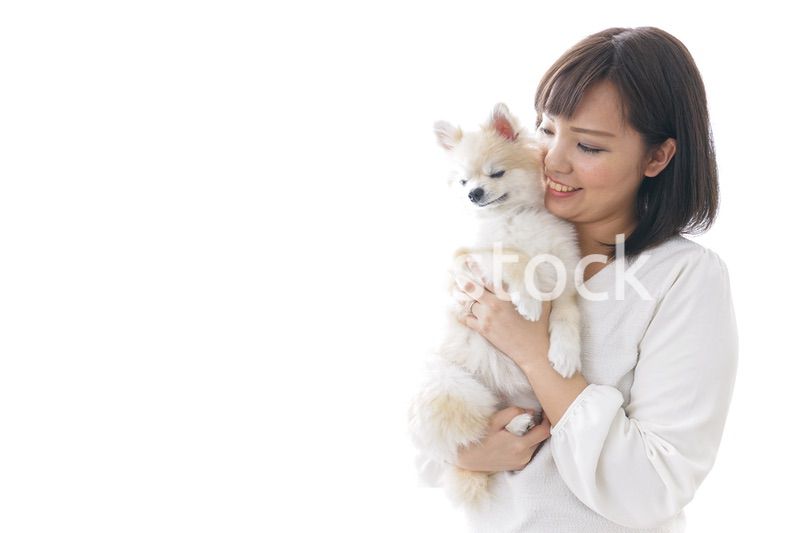 犬を抱く女性・ブリーダー