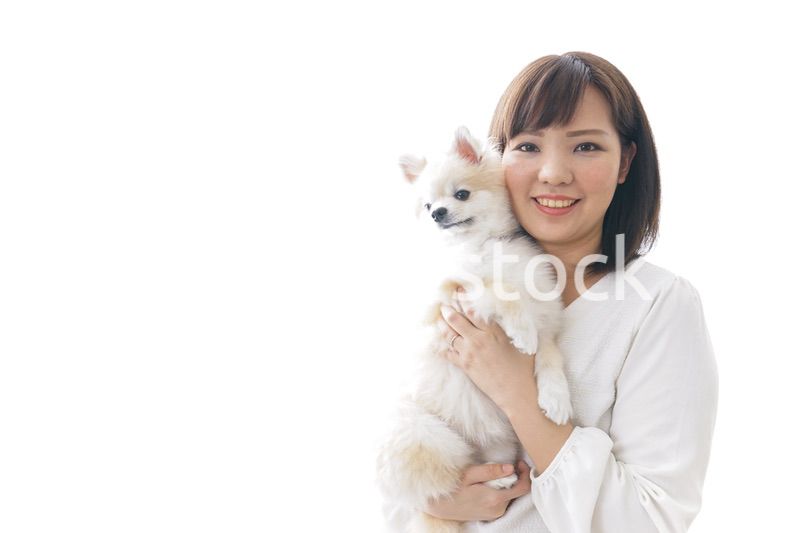 犬を抱く女性・ブリーダー