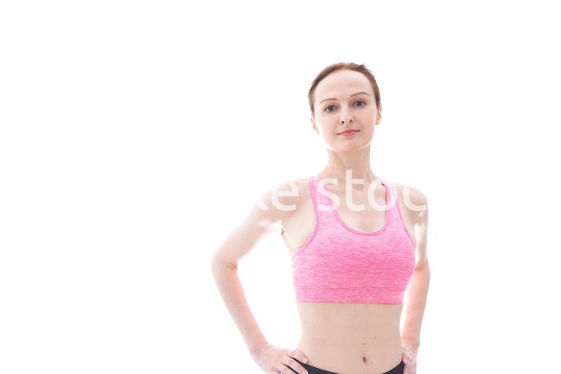 ダイエットをするスポーツウェアを着た若い女性