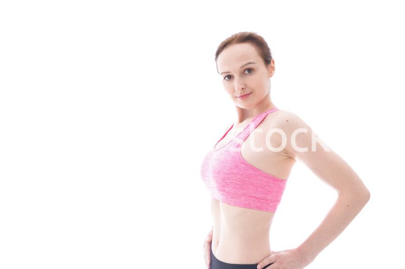 ダイエットをするスポーツウェアを着た若い女性