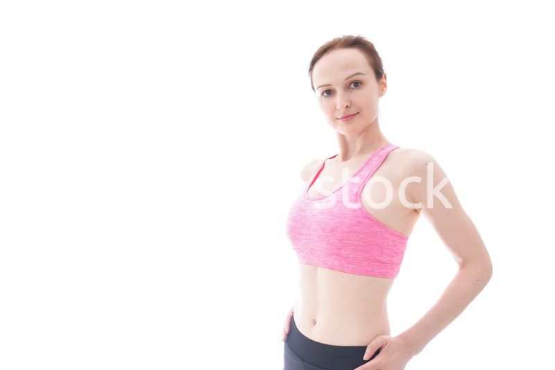 ダイエットをするスポーツウェアを着た若い女性