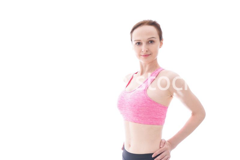 ダイエットをするスポーツウェアを着た若い女性