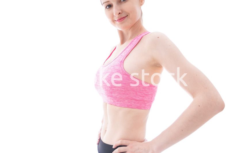 ダイエットをするスポーツウェアを着た若い女性