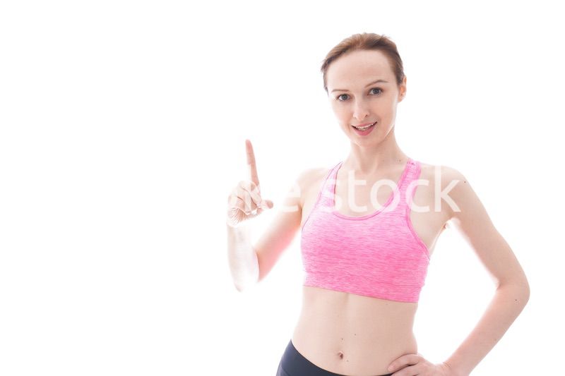 アドバイスをするスポーツウェアを着た若い女性