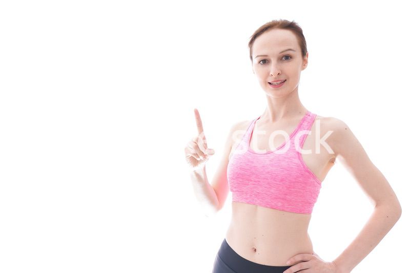 アドバイスをするスポーツウェアを着た若い女性