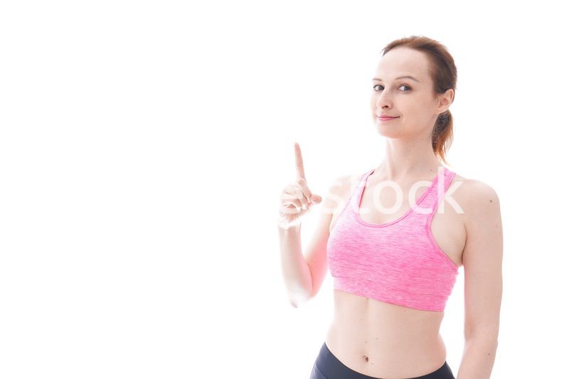 アドバイスをするスポーツウェアを着た若い女性