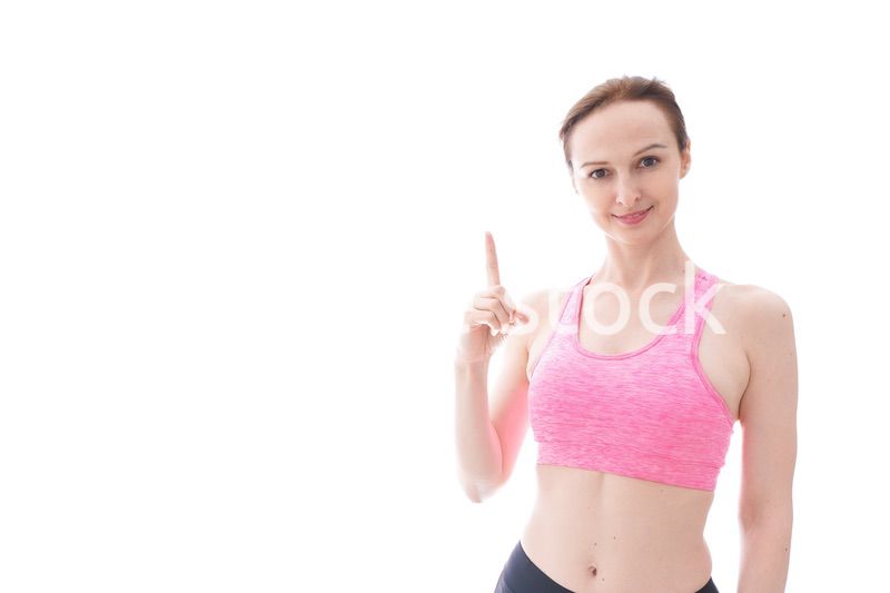 アドバイスをするスポーツウェアを着た若い女性