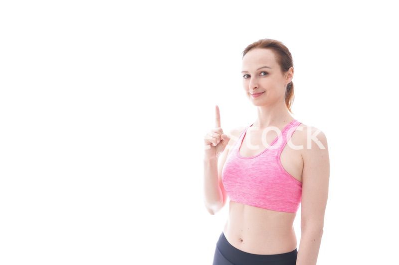 アドバイスをするスポーツウェアを着た若い女性