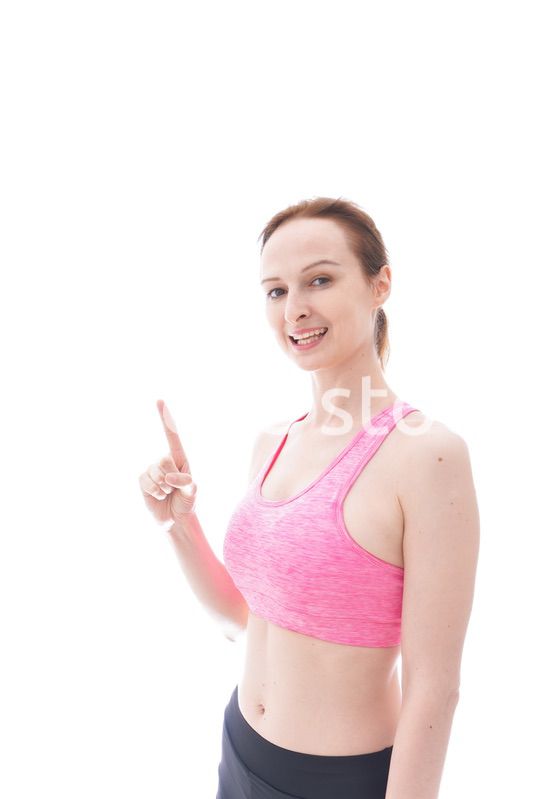 アドバイスをするスポーツウェアを着た若い女性