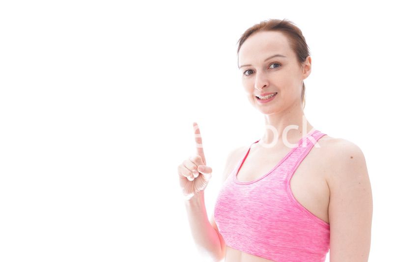 アドバイスをするスポーツウェアを着た若い女性