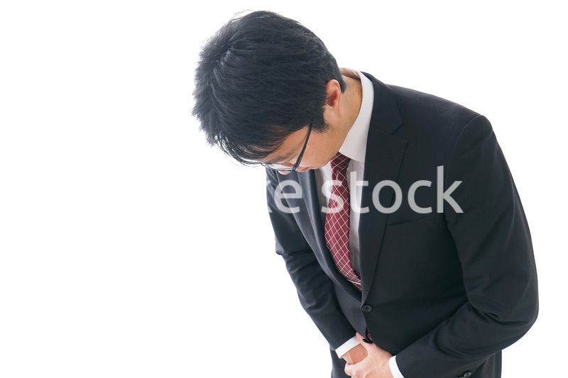 謝罪をするビジネスマン・謝罪会見