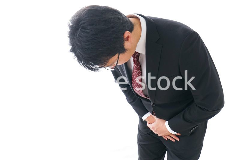 謝罪をするビジネスマン・謝罪会見