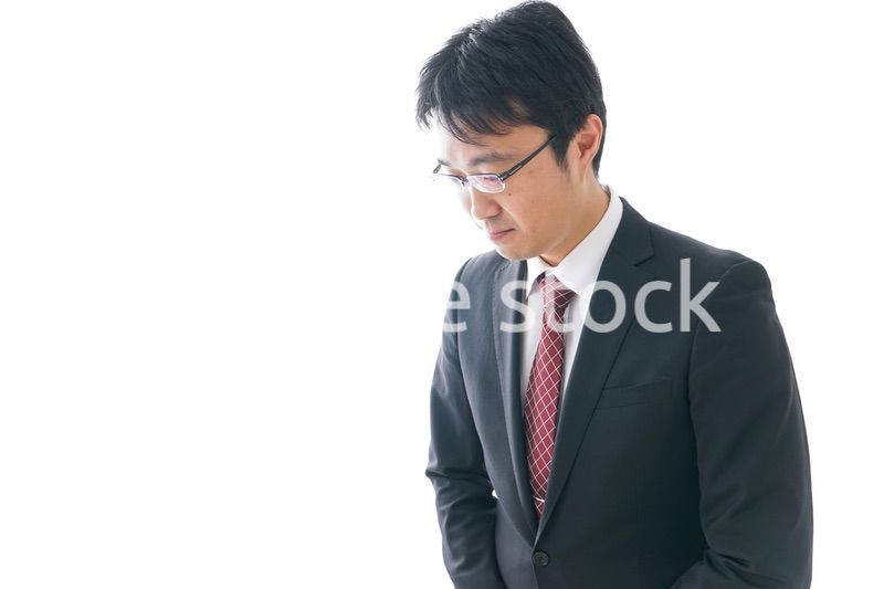 謝罪をするビジネスマン・謝罪会見