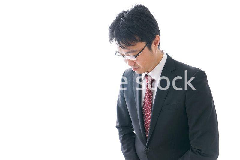 謝罪をするビジネスマン・謝罪会見