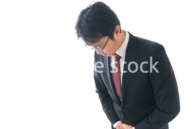 謝罪をするビジネスマン・謝罪会見