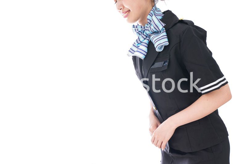 お辞儀をするキャビンアテンダント