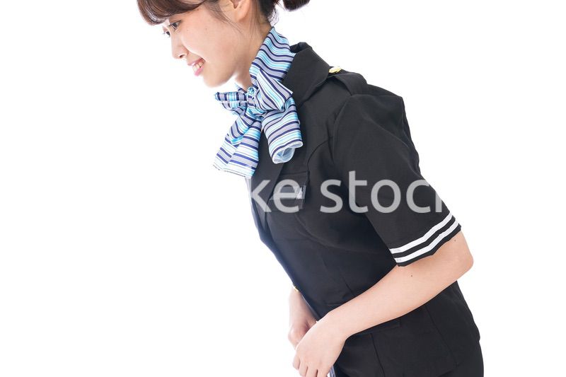 お辞儀をするキャビンアテンダント