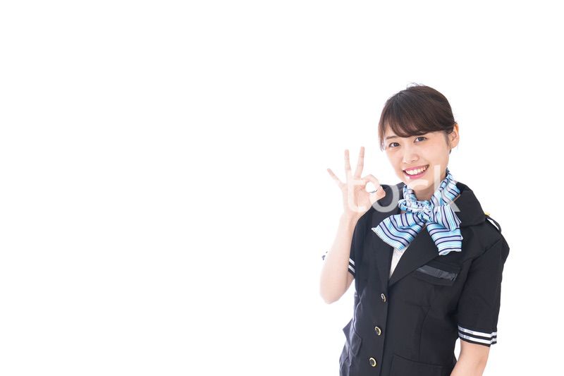 OKの合図をするキャビンアテンダント