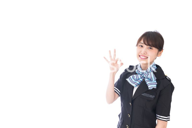 OKの合図をするキャビンアテンダント