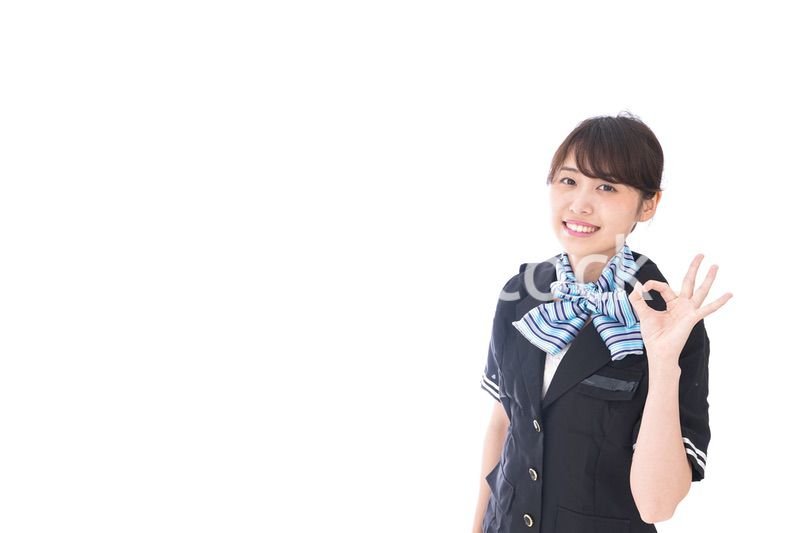 OKの合図をするキャビンアテンダント