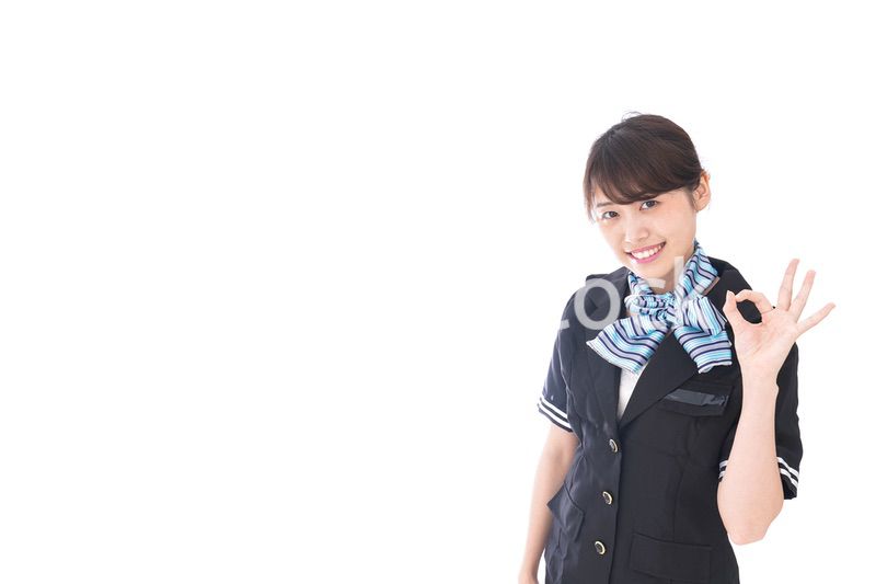 OKの合図をするキャビンアテンダント