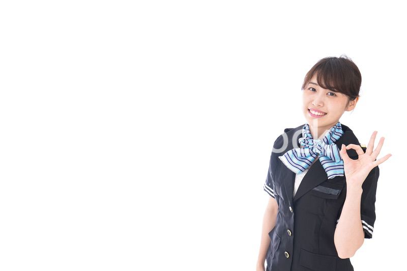 OKの合図をするキャビンアテンダント