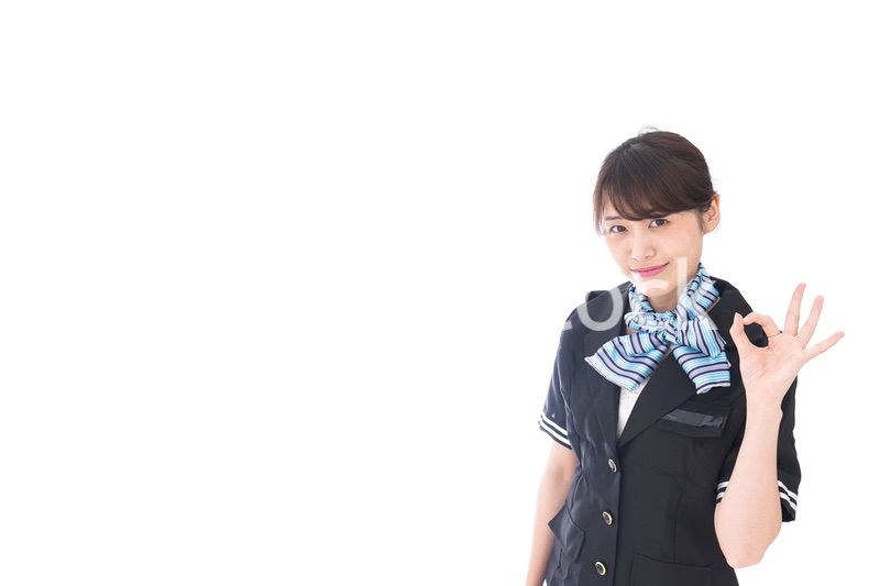 OKの合図をするキャビンアテンダント