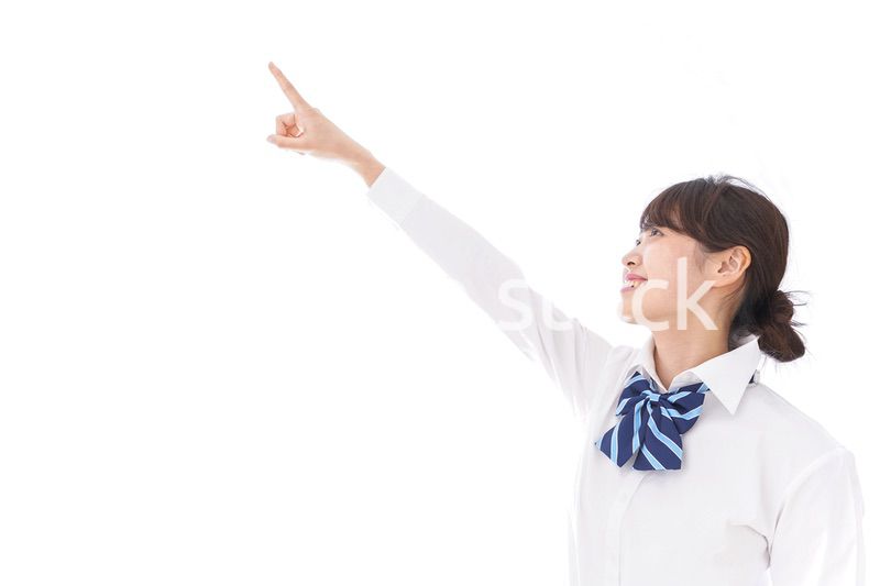 未来を指差す若い学生