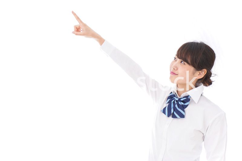 未来を指差す若い学生