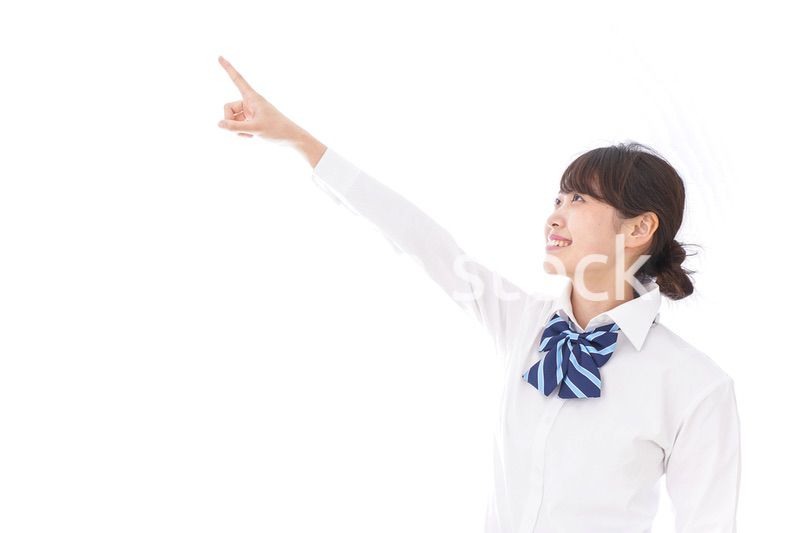 未来を指差す若い学生